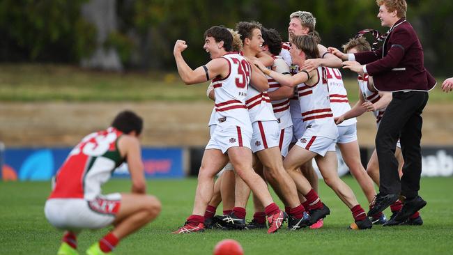 PAC players celebrate at the final siren following their win over Henley High in the All Schools Cup grand final at Thebarton Oval. Picture: Mark Brake