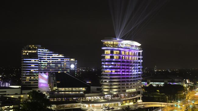 The Star Gold Coast's original Star Grand hotel (left) and The Darling all lit up in Broadbeach as it launches it's new luxury 17-storey hotel The Darling