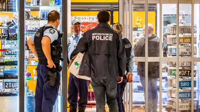 Police officers raid a Sydney tobacconist in 2019. Picture: AAP