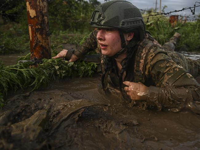 Crawling under barb wire and through the mud was just one of many obstacles. Picture: Ercin Erturk/Anadolu Agency via Getty Images