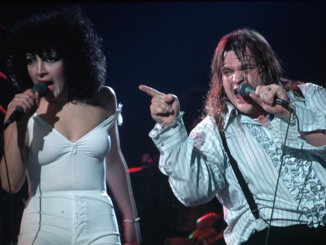 (Original Caption) : Meatloaf on stage performing with Karla Devito. They are shown in a 3/4-length view. He is pointing toward the audience. Photograph, 1978.   (Photo by Lynn Goldsmith/Corbis/VCG via Getty Images)