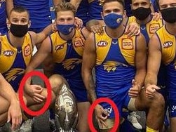 players Jack Redden, Alex Witherden and Jamaine Jones all made an upside-down three-finger OK gesture.