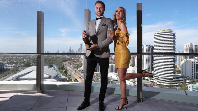 Max Zielinski and Laura Knowles popping champagne at Nineteen at The Star. Picture: Glenn Hampson.