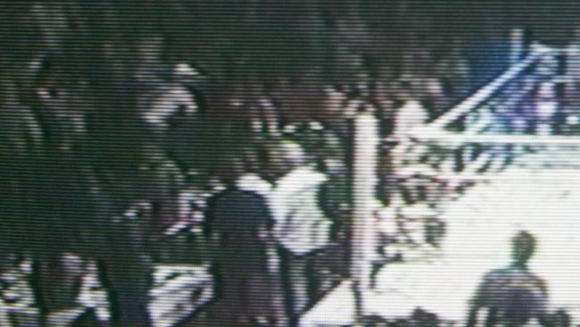 Nine News stills of a bikie gang brawl at a kickboxing fight at Royal Pines Resort.