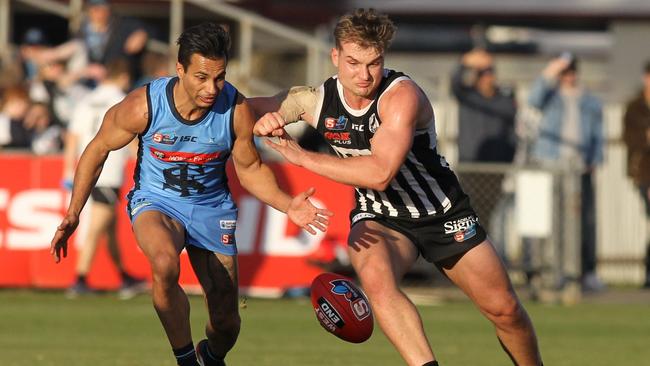 Port's Olie Wines in action against Sturt's Danyle Pearce. Picture: AAP/Dean Martin