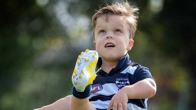 The drug Voxzogo enables 10-year-old Oscar Rose, who has a passion for the Geelong Cats AFL team, to grow at the same rate as other children his age. Picture: Jay Town