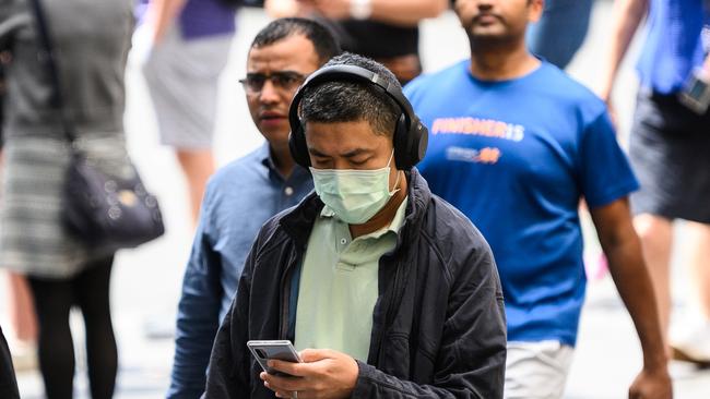 A man wearing a protective face mask seen in Sydney. Pictrure: AAP /James Gourley.