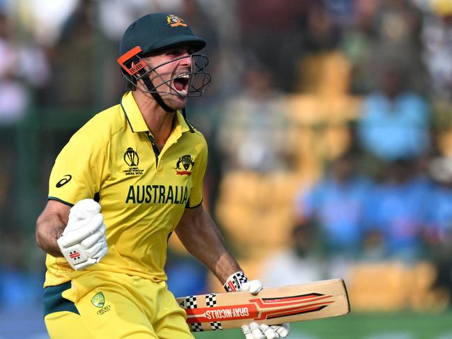 TOPSHOT - Australia's Mitchell Marsh celebrates after scoring a century (100 runs) during the 2023 ICC Men's Cricket World Cup one-day international (ODI) match between Australia and Pakistan at the M. Chinnaswamy Stadium in Bengaluru on October 20, 2023. (Photo by R.Satish BABU / AFP) / -- IMAGE RESTRICTED TO EDITORIAL USE - STRICTLY NO COMMERCIAL USE --