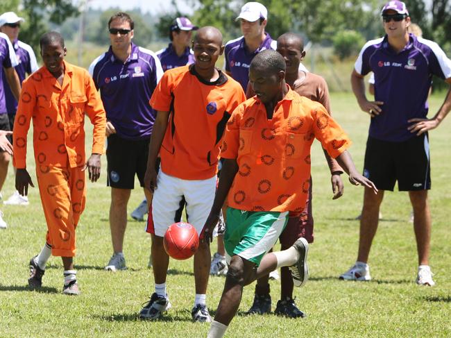 Fremantle’s South Africa trip included a visit to Potchesfstroom Prison for a footy clinic.