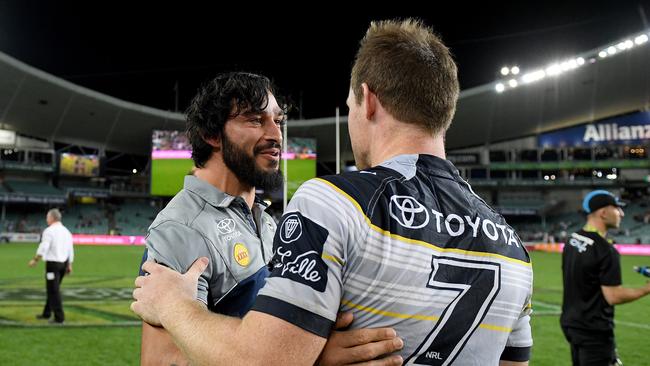 Jonathan Thurston congratulates Michael Morgan.