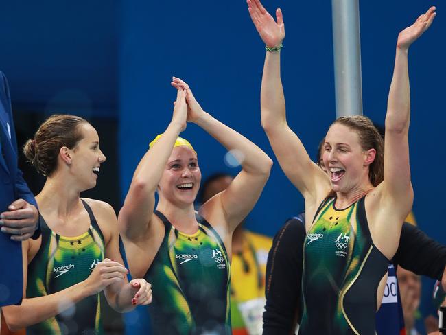 Emma McKeon, Leah Neale and Bronte Barratt celebrate a silver in the 4x200m freestyle relay. Picture. Phil Hillyard