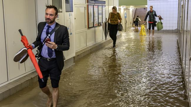 Commuters struggle against torrential rain and gale force winds in Lewisham in Sydney’s inner-west. Picture: Nicholas Eagar