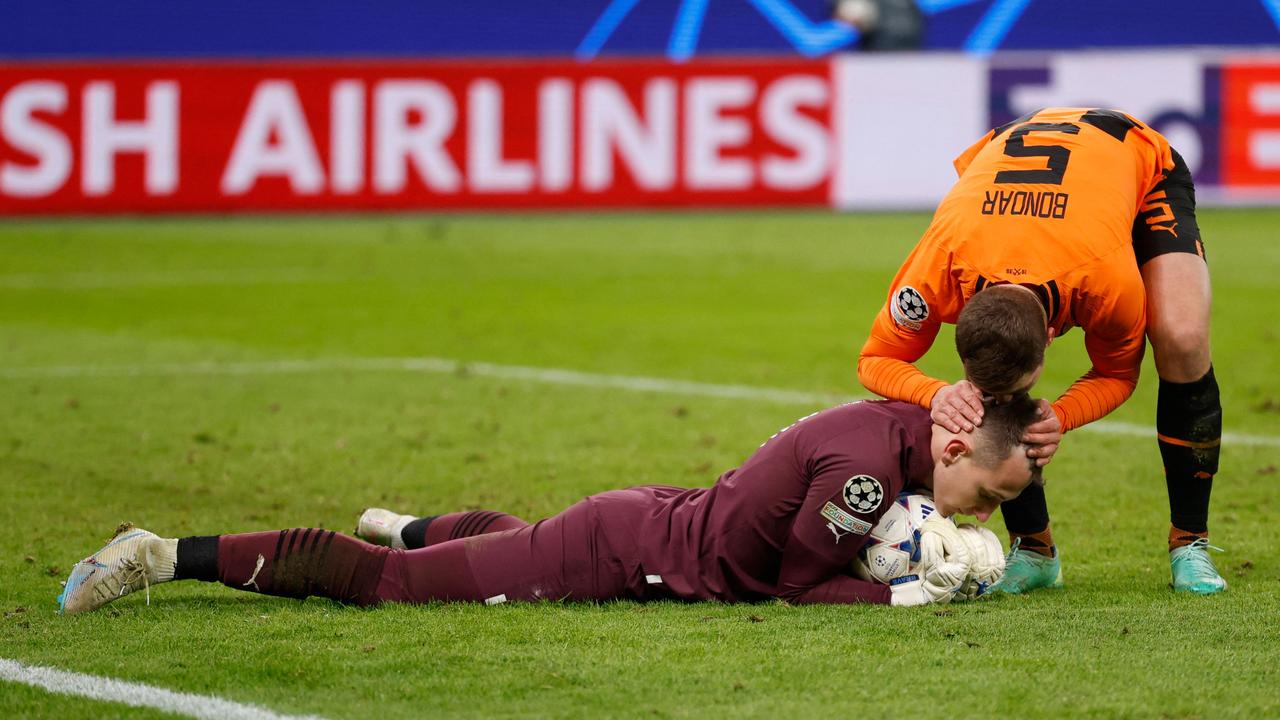 Valeriy Bondar kisses teammate Dmytro Riznyk after winning the UEFA Champions League match between Shaktar Donetsk and Antwerp. Picture: Axel Heimken/AFP