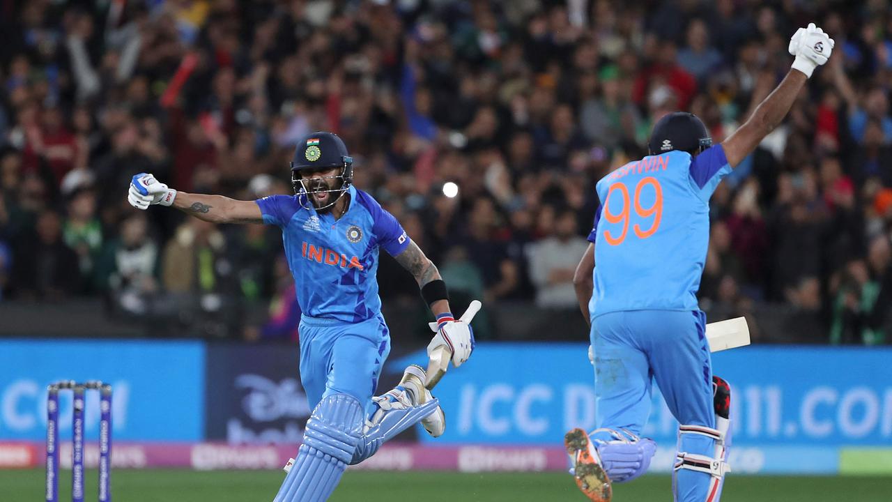 India's Virat Kohli (L) and Ravichandran Ashwin celebrate their incredible win over Pakistan at the MCG on October 23, 2022. Photo: AFP