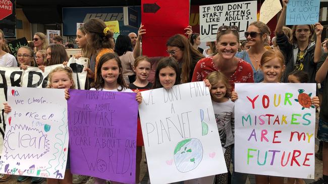 Mum Shannon Morrell, 45, of North Balgowlah with her children Ella, 8, and Zoe, 6, at the climate change protest, with their friends. Picture: Julie Cross.