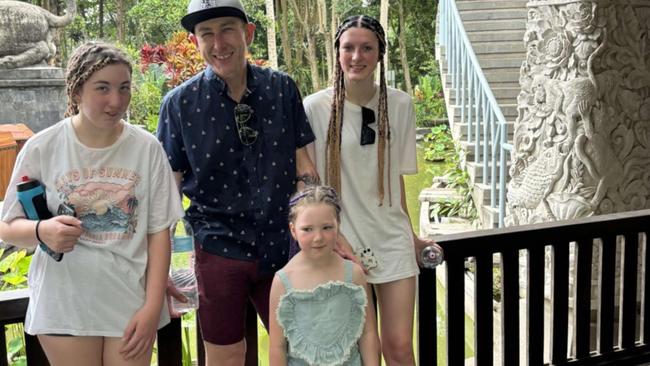 Aldi store manager Aaron Nordbye of Melbourne, his partner Hariet and daughters Emily, 16, Ava, 14, and Audrey, 5, are stranded in Bali due to the volcano.