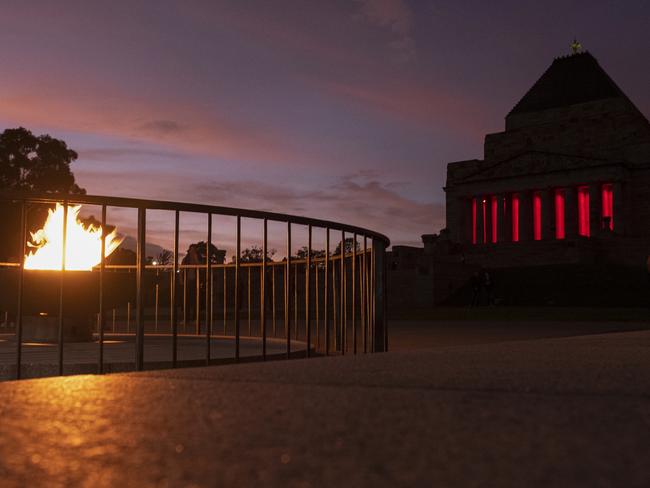 People pay their respects during the Anzac Day Dawn Service at the Shrine of Remembrance in Melbourne, Saturday, April 25, 2020. Anzac Day is a national day of remembrance to commemorate the service and sacrifice of Australian and New Zealand service men and women. Due to COVID-19 restrictions marches and commemorative services have been banned for the first time in more than a century. (AAP Image/Daniel Pockett) NO ARCHIVING