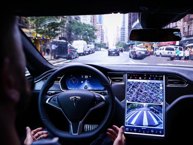 A driver rides in a Tesla Motors Inc. Model S vehicle equipped with Autopilot hardware and software. PHOTO: CHRISTOPHER GOODNEY/BLOOMBERG NEWS