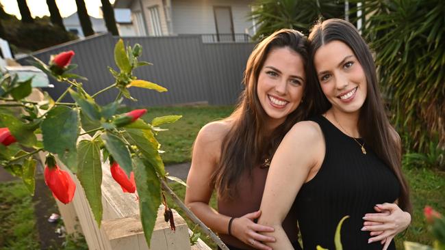 Brisbane sisters Holly, 23, and Ashley Creak, 25, pregnant with her first child, says they are both optimistic about the future. Picture: Lyndon Mechielsen