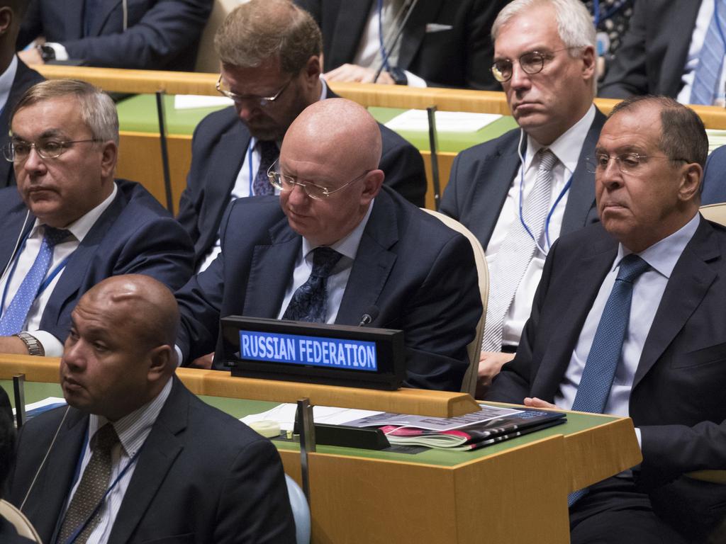 Russian Foreign Minister Sergey Lavrov, right, and Ambassador to the United Nations Vassily Nebenzia, centre, listen as President Donald Trump addressed the UN. Picture: AP