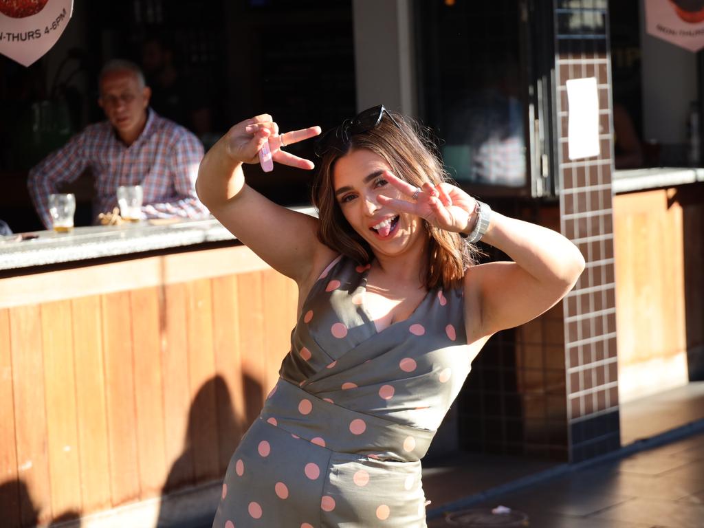 Punters are pictured dressed up and enjoying themselves on Melbourne Cup Day in Sydney.