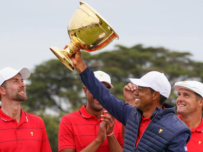 Woods lifts the Cup as his teammates celebrate their come-from-behind victory.