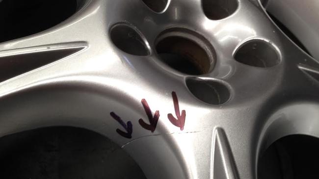 Hairline fracture ... A crack forms on a counterfeit Holden wheel. Picture: Joshua Dowling