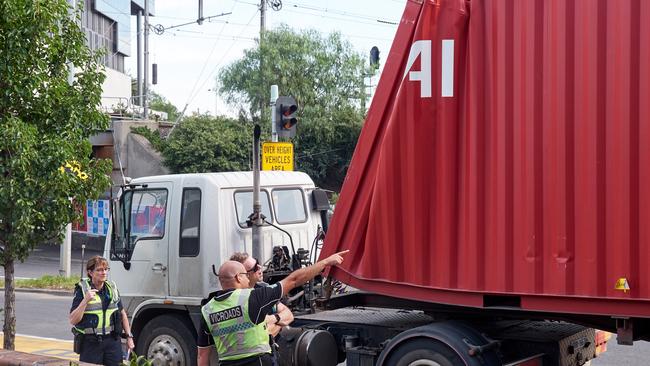 VicRoads staff investigate following this morning’s crash. Picture: Martin Wurt/MTAG   