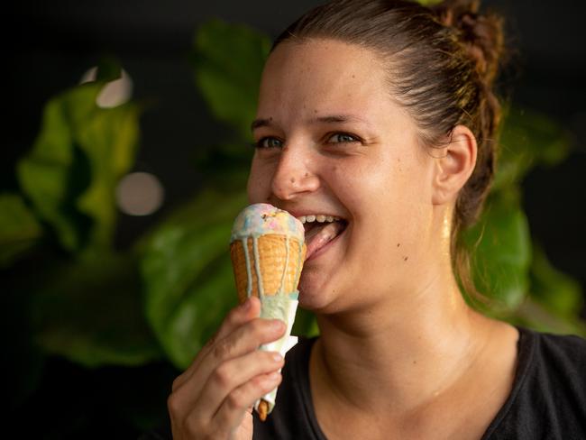 Following up on businesses in the aftermath of a blackout across Darwin. A 'one-off' blunder that occurred during routine maintenance at the NTÃs largest power station led to the widespread electricity outage that plunged the Top End into darkness on Wednesday. Fannie Bay Cool Spot sales assistant Clemence Le Bot takes on a rapidly melting ice cream. Picture: Che Chorley