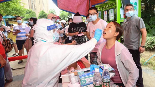 A Wuhan resident is given a nucleic acid test for the coronavirus. Picture: AFP