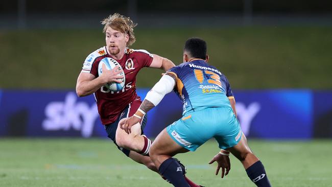 Harry McLaughlin-Phillips of the Queensland Reds (L) looks for a gap during the round eight Super Rugby Pacific match between Moana Pasifika and Queensland Reds at Semenoff Stadium, on April 12, 2024, in Whangarei, New Zealand. (Photo by Fiona Goodall/Getty Images)