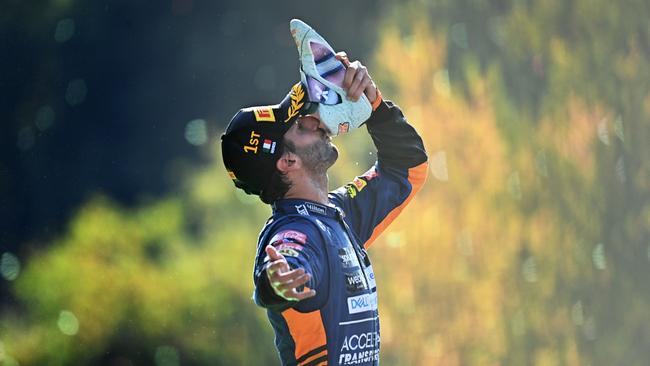 MONZA, ITALY – SEPTEMBER 12: Race winner Daniel Ricciardo of Australia and McLaren F1 celebrates on the podium during the F1 Grand Prix of Italy at Autodromo di Monza on September 12, 2021 in Monza, Italy. (Photo by Clive Mason – Formula 1/Formula 1 via Getty Images)