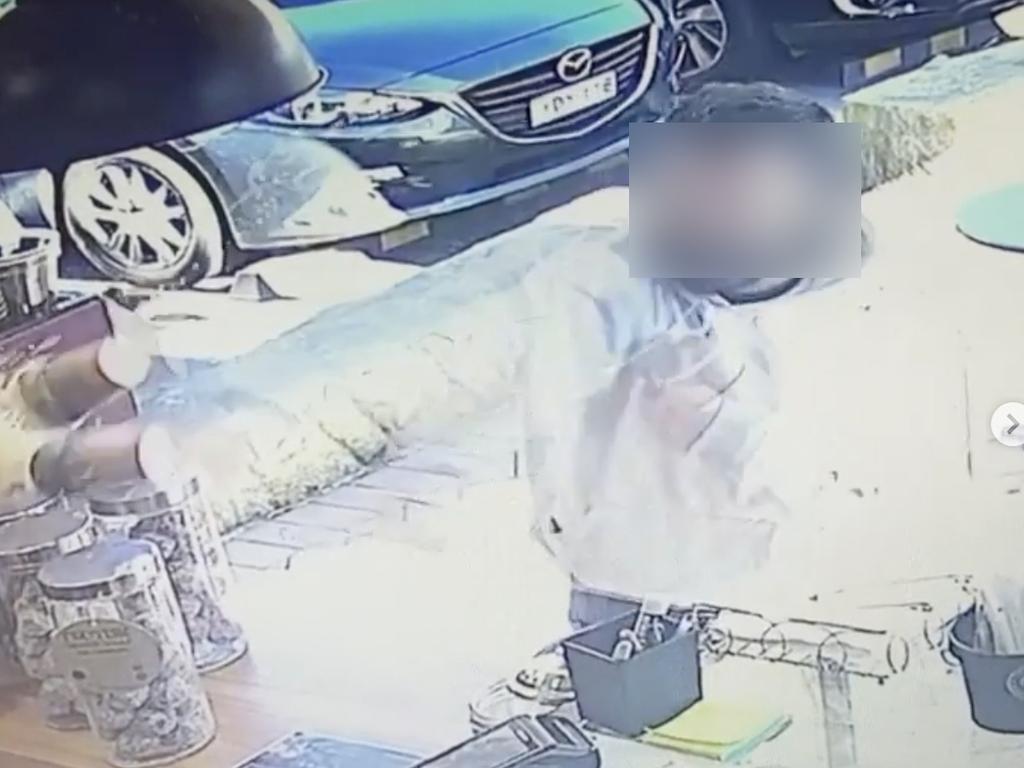 CCTV footage shows a man allegedly throwing the hot coffee. Picture: Instagram