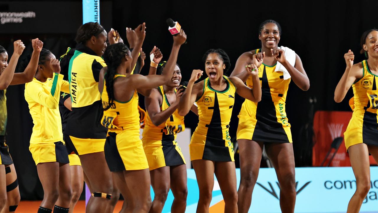 Team Jamaica celebrate winning the match