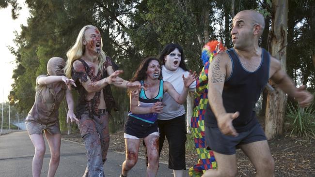 people running away scared from zombies