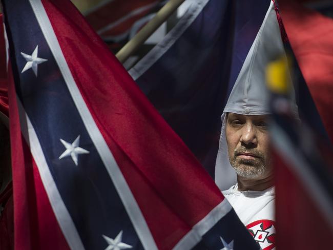 A member of the Ku Klux Klan calls for the protection of Southern Confederate monuments, in Charlottesville, Virginia. Picture: Andrew Caballero-Reynolds/AFP