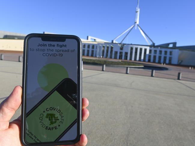 An iPhone displays the CovidSafe app released by the Australian government in front of Parliament House in Canberra. Picture; AAP.