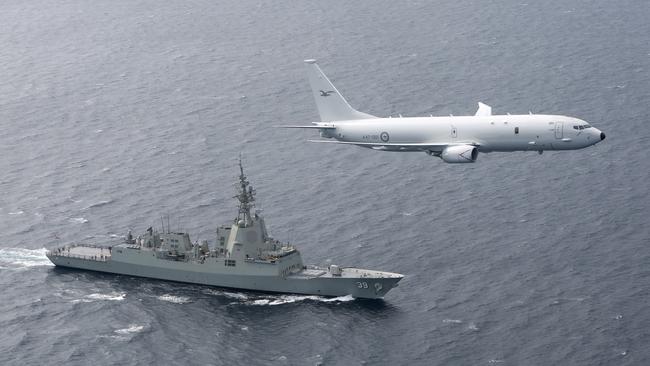 An RAAF P-8A Poseidon supports sea trials for the NUSHIP Hobart in the Gulf of St Vincent off the coast of Adelaide. Picture: Defence