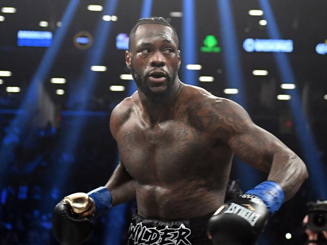 (FILES) In this file photo taken on March 03, 2018 heavyweight champion Deontay Wilder of the US fights contender Luis Ortiz of Cuba (out of frame) during their WBC heavyweight title fight in New York. The World Boxing Council has vowed to investigate heavyweight champion Deontay Wilder after he was quoted as saying he wanted to cause a death in a boxing ring. In an interview with syndicated New York radio show, The Breakfast Club, Wilder triggered revulsion throughout boxing by saying he hoped to "have a body" on his record.  / AFP PHOTO / Timothy A. CLARY