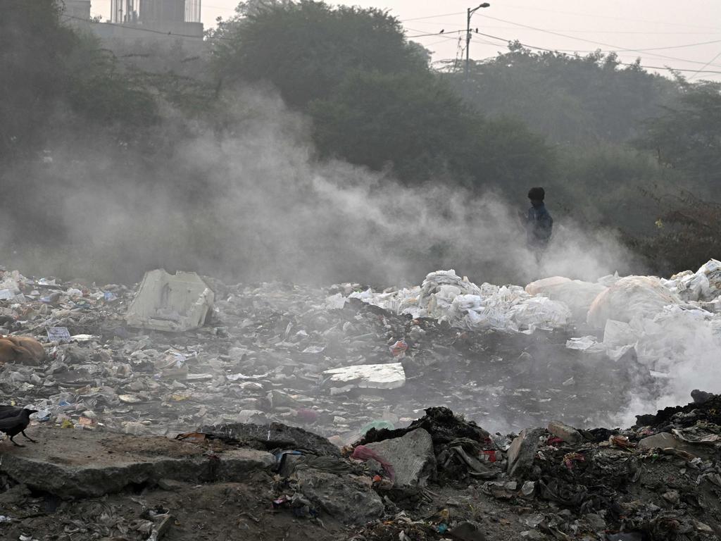 Smoke billows from burning garbage amid smoggy conditions at the Ghazipur landfill in New Delhi. Picture: Arun Sankar/AFP