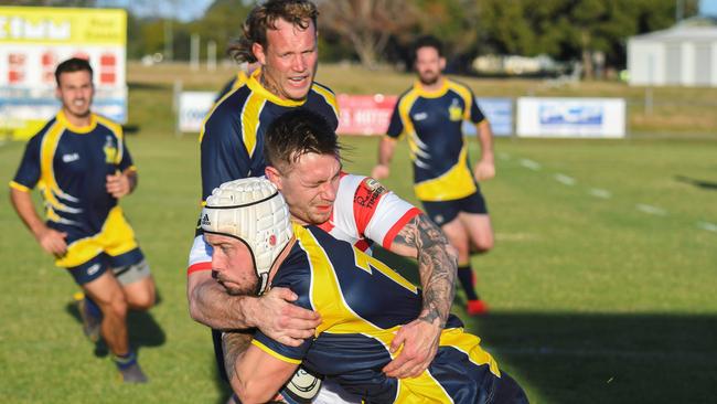 CRUNCH: Grafton Redmen winger Nic McCabe halts the progress of a Casuarina player. Unfortunately it wasn't enough to stop a late second-half scoring blitz by the visitors.