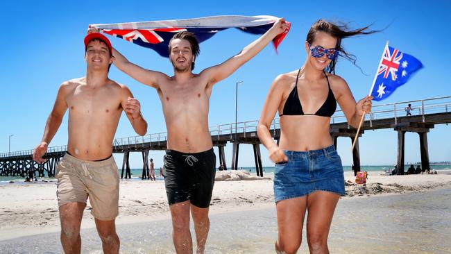 A Ãvibe shiftÃ against corporate activism has led to a surge in support for celebrating Australia Day on January 26, a new analysis has found, with increasing numbers of younger Australians saying the nation should keep the date. At Largs Bay, the Webb siblings from Mt. Barker, Luke,23,(with towel)(0415910179) Georgia,22, and Blake,15, are more than happy to celebrate Australia Day. 12 January 2025. Picture: Dean Martin