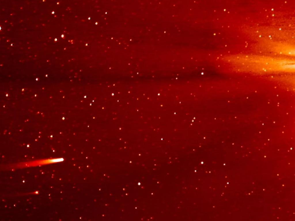 Comet Ison, left, is seen above the more distant and fainter comet Encke in November 2013, as the pair approached the Sun. Picture: NASA