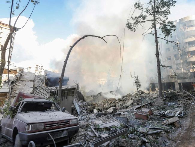 Smoke billows from the site of an overnight Israeli airstrike in Beirut's southern suburb of Hadat on October 2, 2024. At least five Israeli strikes hit Beirut's southern suburbs early October 2, a Lebanese security source said, as the Israeli military said it was targeting Hezbollah sites and issued several evacuation orders. (Photo by IBRAHIM AMRO / AFP)