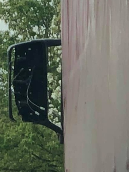 The truck was left with damage to its mirror.