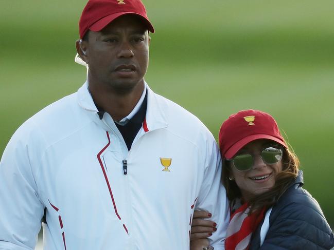 JERSEY CITY, NJ - SEPTEMBER 30:  Captain's assistant Tiger Woods of the U.S. Team and Erica Herman look on during Saturday four-ball matches of the Presidents Cup at Liberty National Golf Club on September 30, 2017 in Jersey City, New Jersey.  (Photo by Rob Carr/Getty Images)