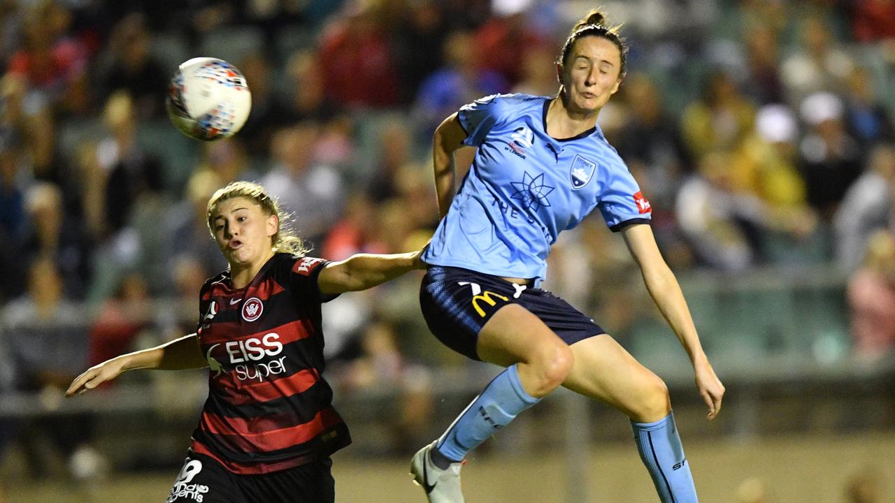 Rosie Sutton (left) of the Wanderers competes for possession with Sydney FC’s Rachael Soutar at Marconi Stadium on Thursday night. Picture: AAP