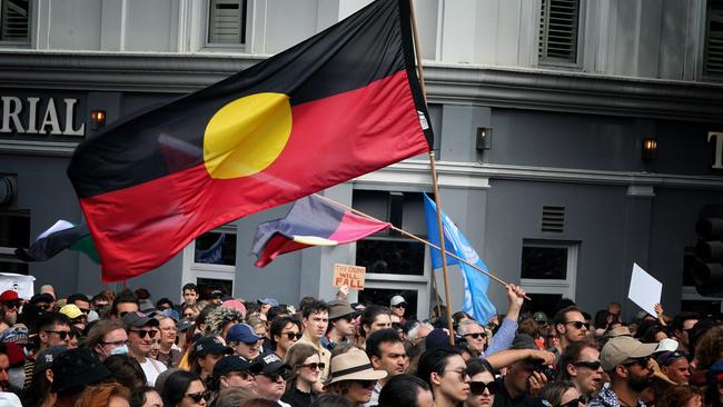 Protesters gather outside the Victorian parliament for an Invasion Day rally. Picture: NCA NewsWire / Luis Enrique Ascui