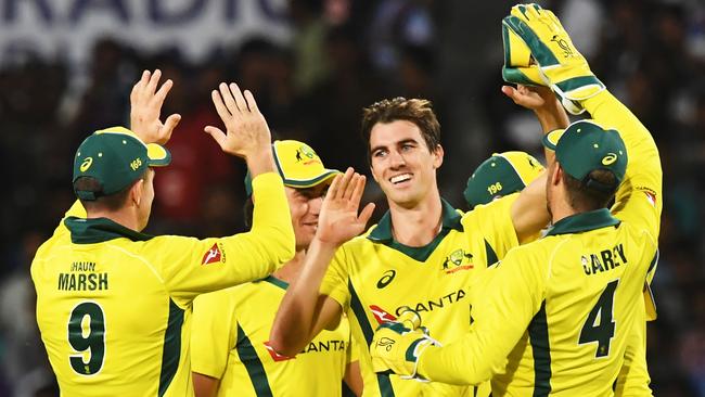 Australian cricketer Pat Cummins (C) celebrates with teammates after taking the wicket of Indian cricketer Ambati Rayudu during the third one-day international (ODI) cricket match between India and Australia at the Jharkhand State Cricket Association International Cricket Stadium, in Ranchi on March 8, 2019. (Photo by DIBYANGSHU SARKAR / AFP)