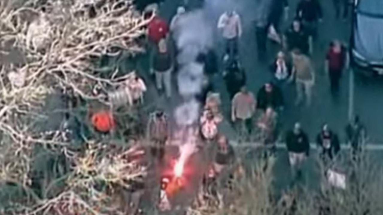 Hundreds of protestors have gathered in Melbourne setting off flares as police try and disperse the crowd. Picture: ABC News